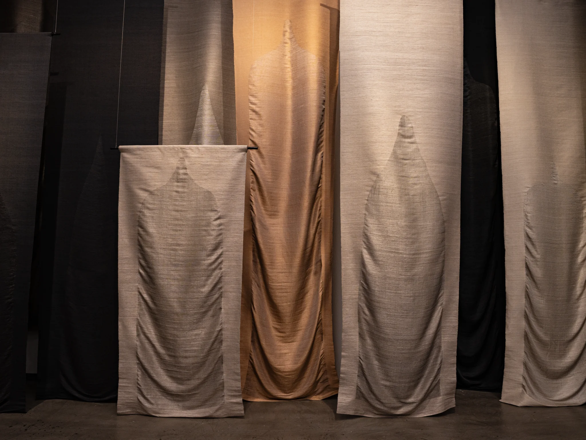 Pinaree Sanpitak, Breast Stupas, 2000-2001. Unthreaded silk Fabric supported by Jim Thompson, The Thai Silk Co. Ltd, 500 x 122 cm (each). Photo: Aroon Peampoonsopon . Courtesy of the Jim Thompson Art Center and the James H.W. Thompson Foundation © Jim Thompson Art Center