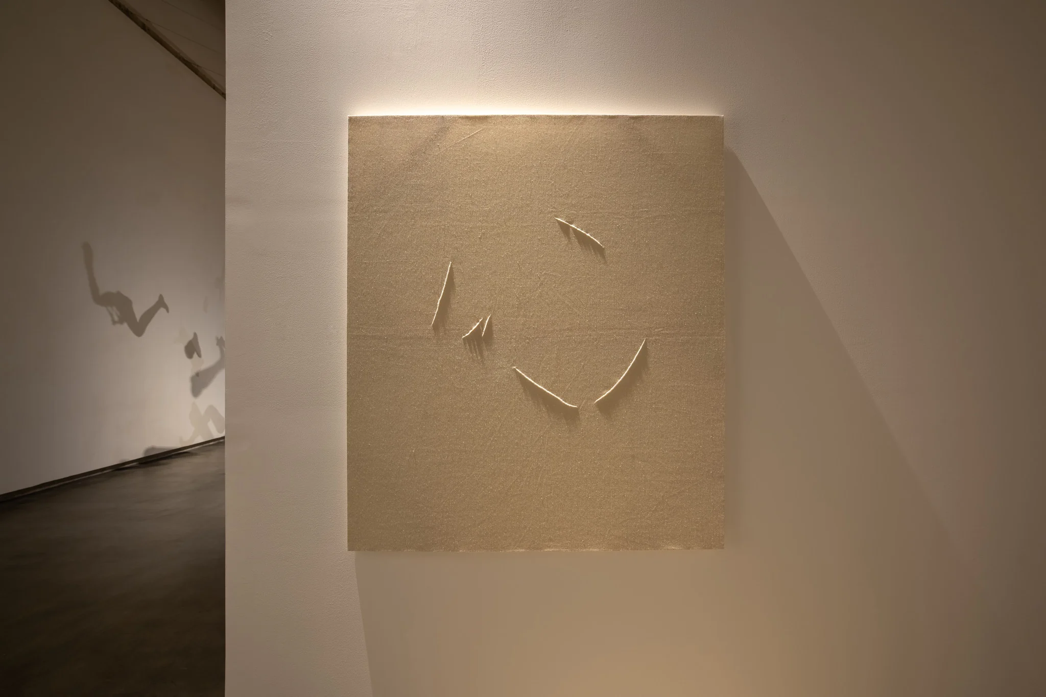 Kader Attia, Untitled (Mirrors), 2024. White canvas, 128 x 148 cm.. Photo: Swita Uancharoenkul. Courtesy of the Jim Thompson Art Center and the James H.W. Thompson Foundation © Jim Thompson Art Center