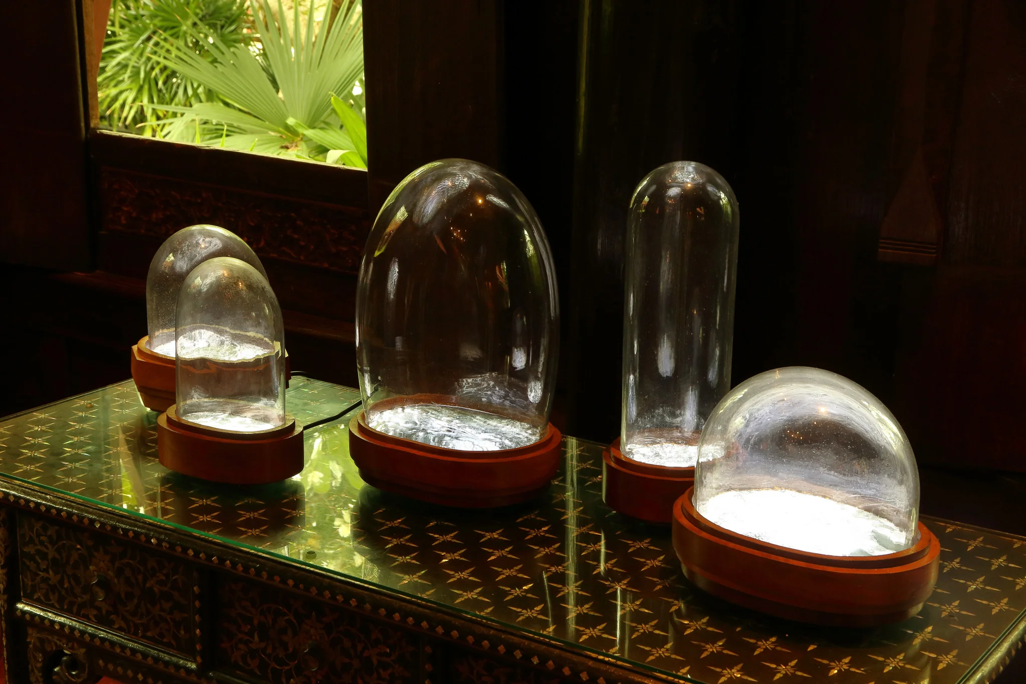 Prateep Suthathongthai, Aerial photograph 1953-1954, 2025. Old aerial photograph printed on a light box covered with traditional glass domes, . Photo: Aroon peampoonsopon. Courtesy of the Jim Thompson Art Center and the James H.W. Thompson Foundation © Jim Thompson Art Center