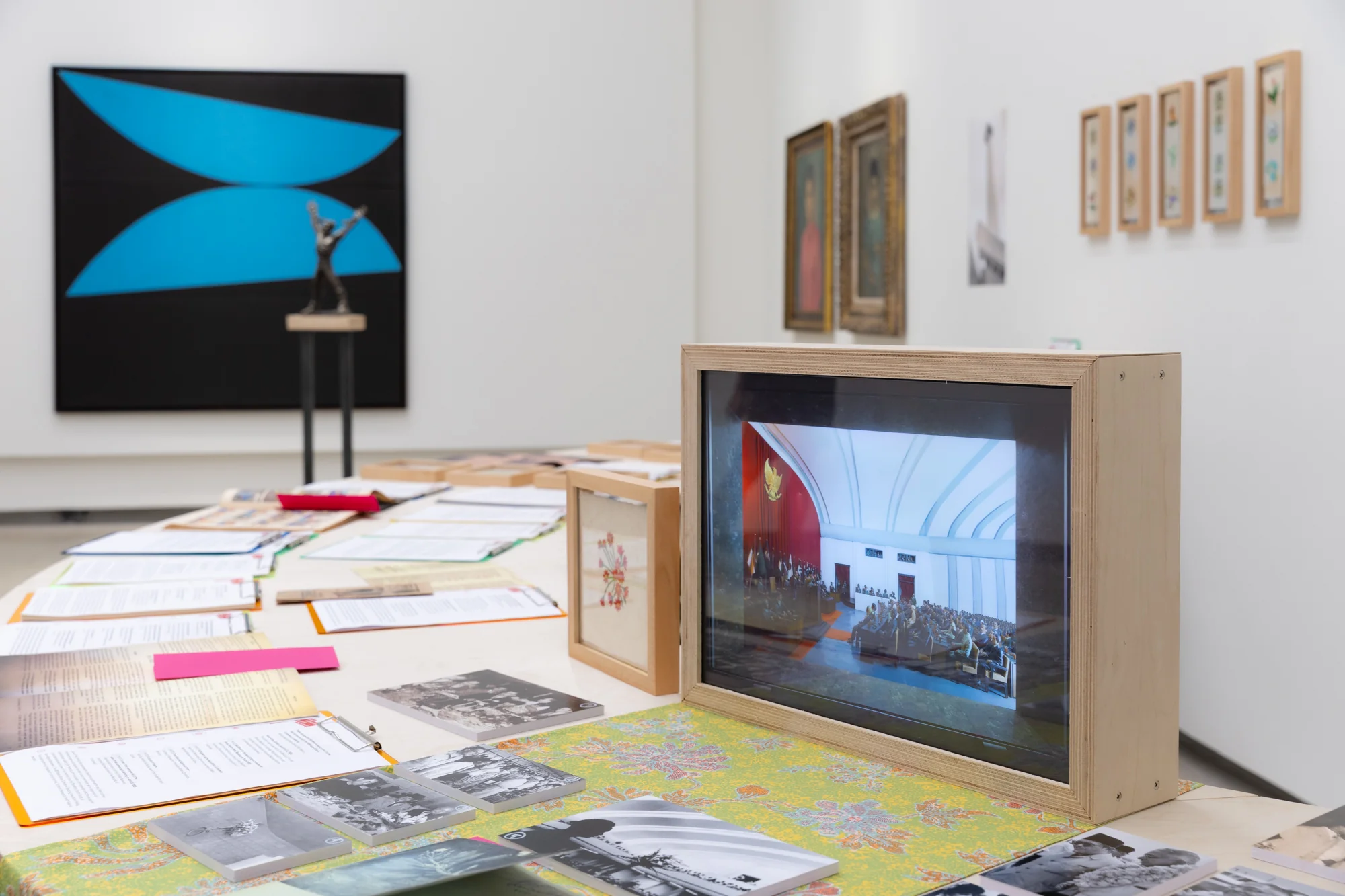 Hyphen—by Grace Samboh, with Andri Setiawan, and  Rachel K. Surijata, A roundabout: Blooming mementos, towards monument, 2025. Research showcase by Hyphen—, commissioned by Jim Thompson Art Center, with works of Arie Syarifudin, Basoeki Abdullah, chitarum, Edhi Sunarso, Kustiyah, Nadiah Bamadhaj, Nasikin Ahmad, Siti Ruliyati, and Viroj Chiam-chirawat., Dimension variable. Photo: BACC. Courtesy of the BACC © BACC